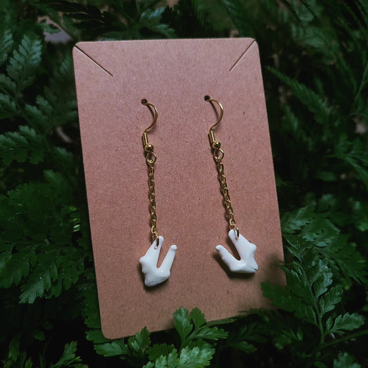 Raccoon tooth dangle earrings