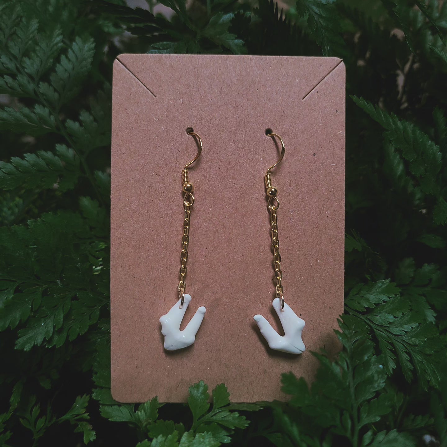 Raccoon tooth dangle earrings
