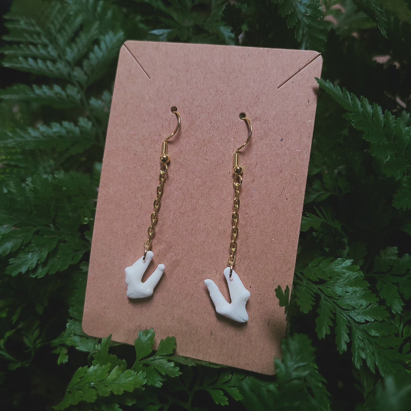 Raccoon tooth dangle earrings