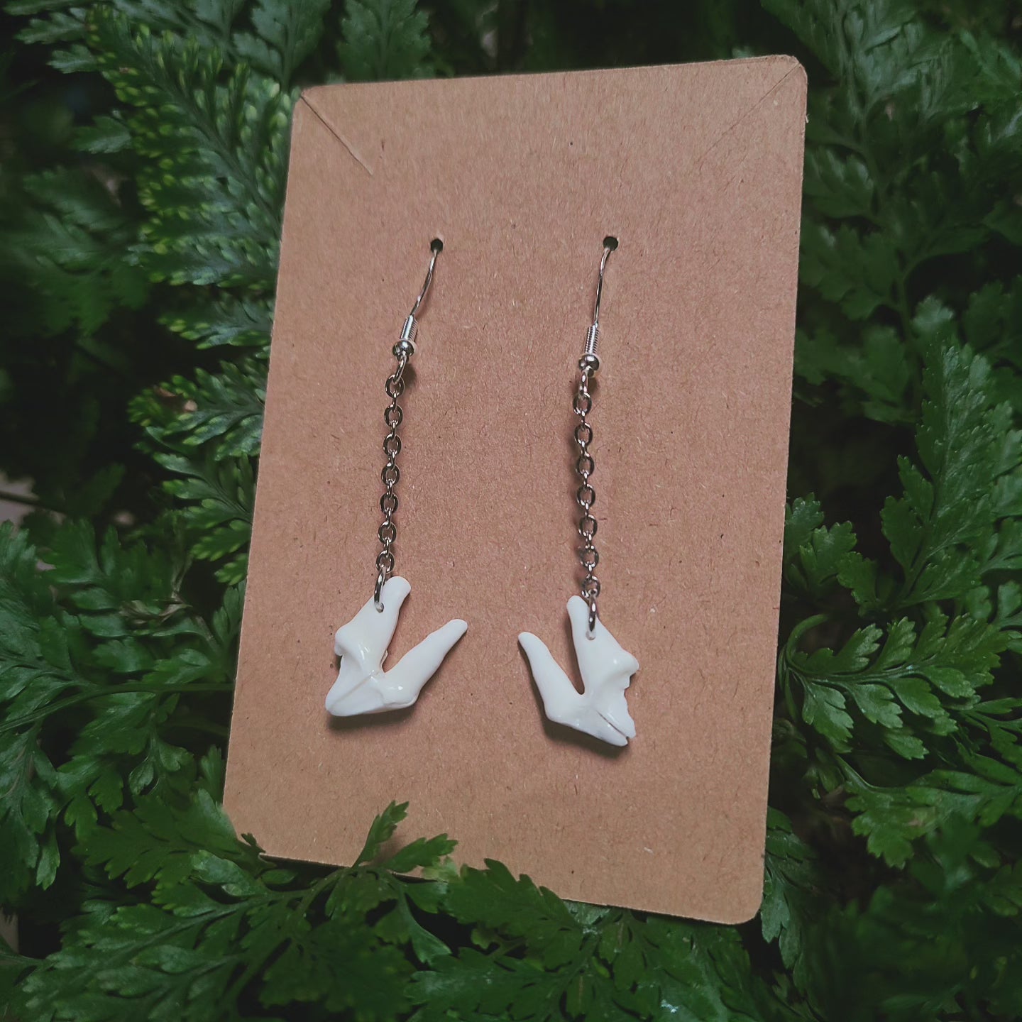 Raccoon tooth dangle earrings
