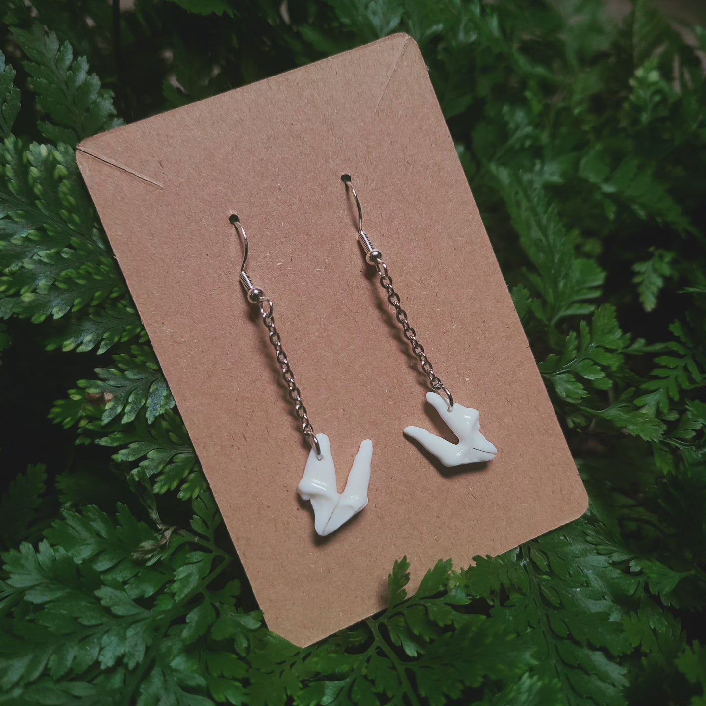 Raccoon tooth dangle earrings