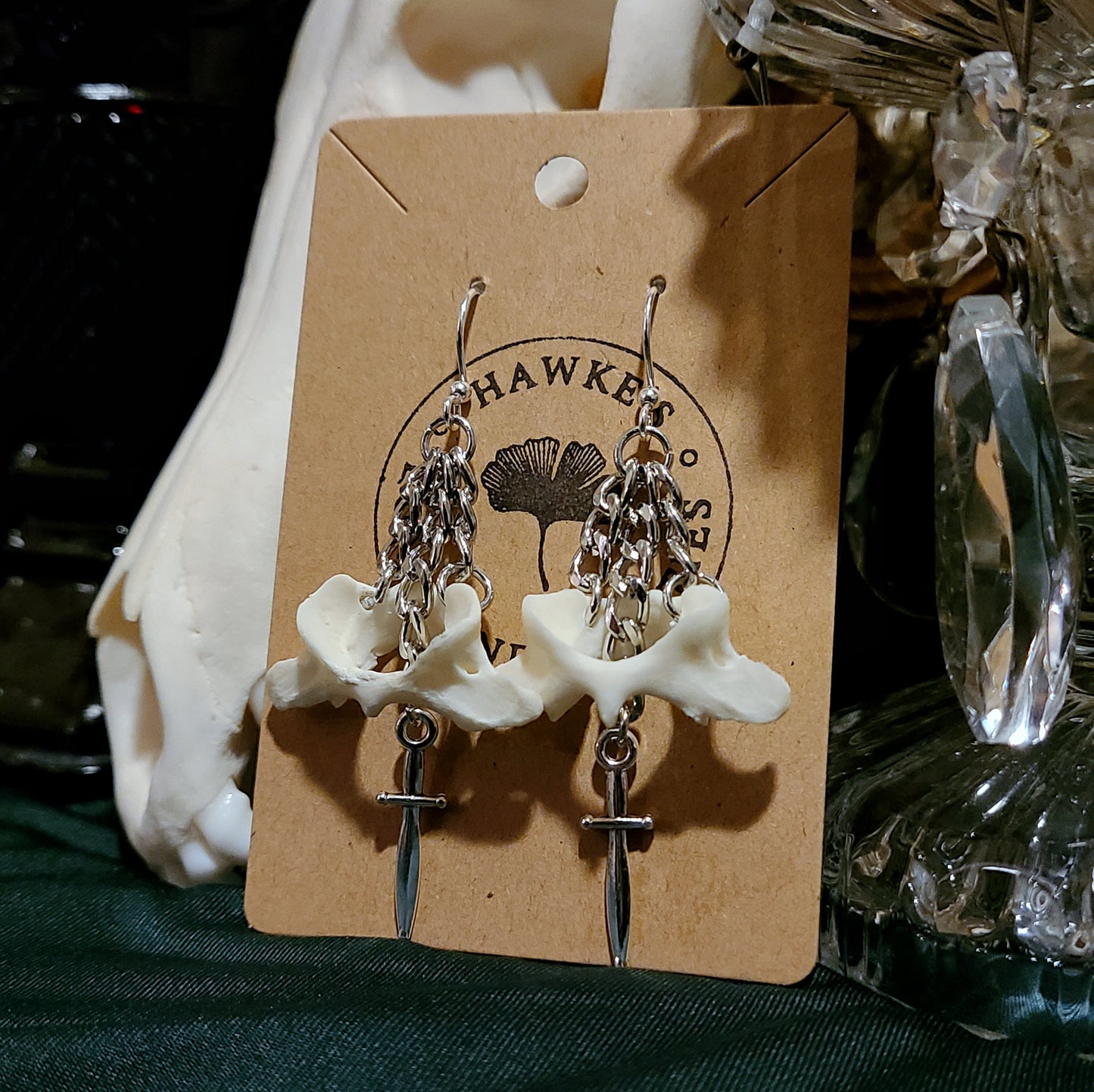 Skunk Atlas and Dagger Dangle Earrings